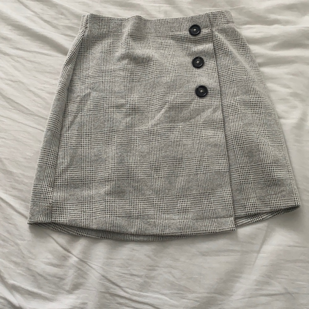 Black and white button skirt.